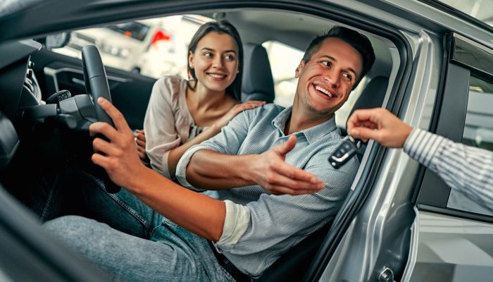at-a-car-dealership-buying-a-car-2021-11-12-21-00-25-utc