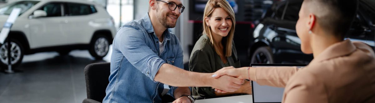 male-customer-and-female-car-dealer-shaking-hands-2021-09-03-05-47-09-utc